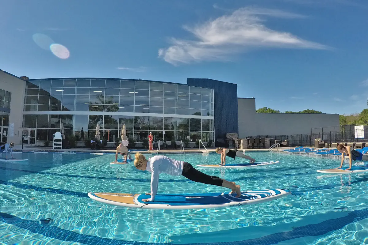 an outdoor pool group workout